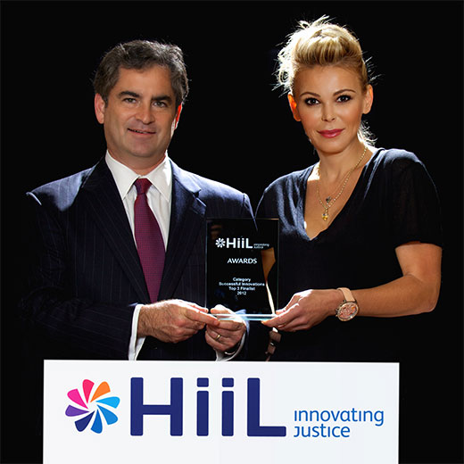 Professor Richard Steinberg and Diana Jenkins with the HiiL Innovating Justice award.